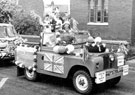 View: c02502 Poynton: Library Float, 1977 Eliz II Silver Jubilee 	