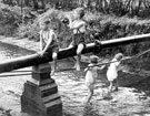 View: c02724 Prestbury: Children Playing on the River Bollin 	