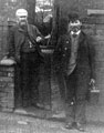 View: c03785 Winsford: Men outside 54 Weaver Street 	