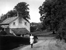 View: c04900 Rostherne: Young woman walking up a lane	